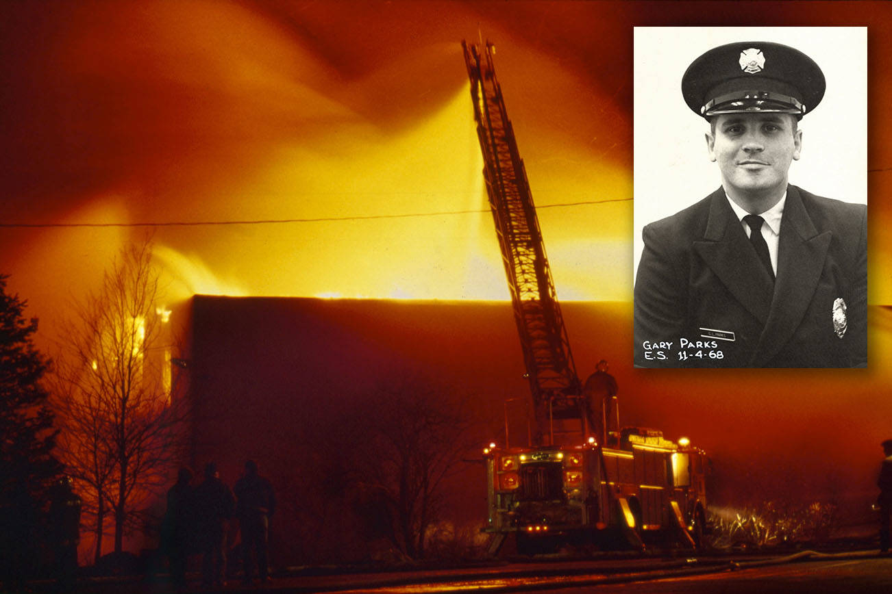 Michael O'Leary / Herald File 1987
A ladder truck shoots water over the south wall of the Everett Community College library complex on Feb. 16, 1987.  The arson destroyed the facility and killed Everett firefighter Gary Parks.