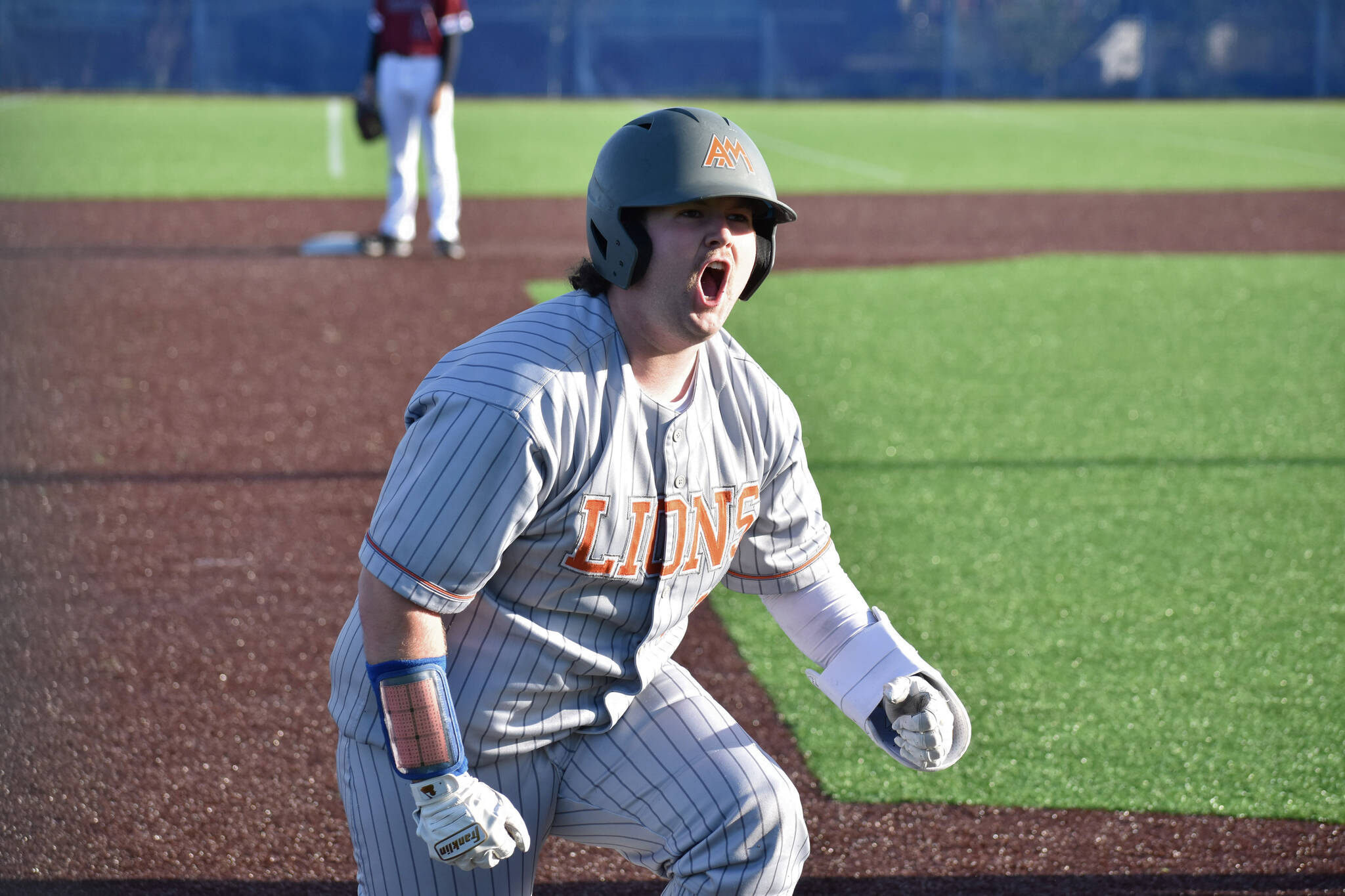 Danner Philbrick gives a yell after a leadoff single and error in the seventh inning. Ben Ray / The Reporter