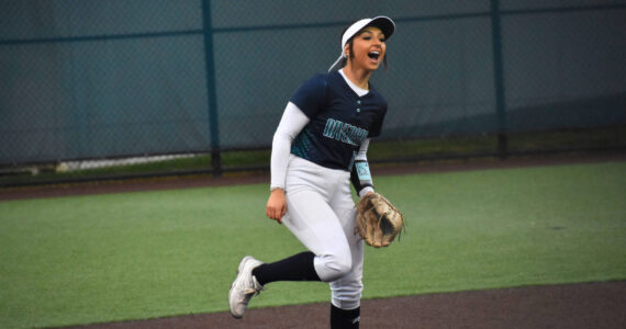 Bailey Brader celebrates a strikeout with a scream in support of Danica Butler. Ben Ray / The Reporter