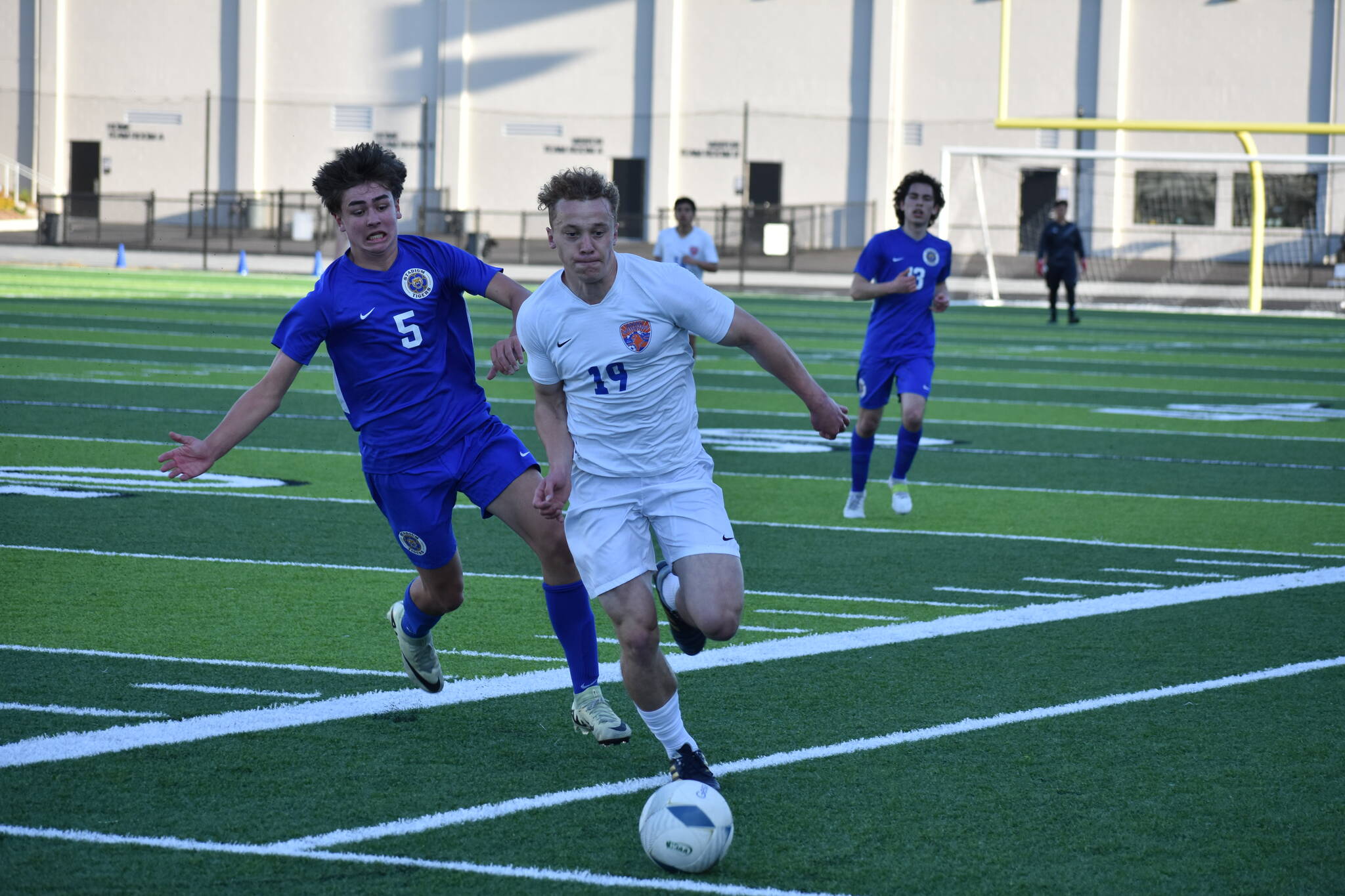 Davyd Fedina chases down the ball at Federal Way Memorial Field against Stadium. Ben Ray / The Reporter
