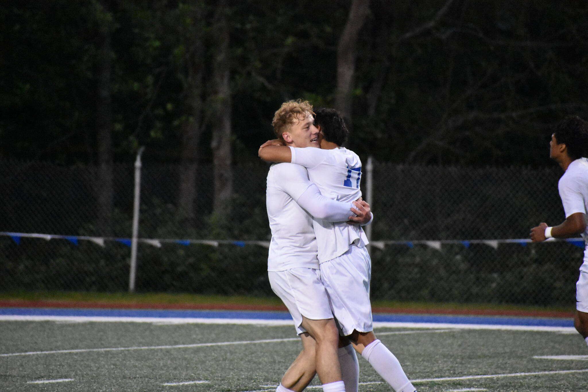 Davyd Fedina and Benji Toscano celebrate the Lions’ third goal of the night. Ben Ray / The Reporter