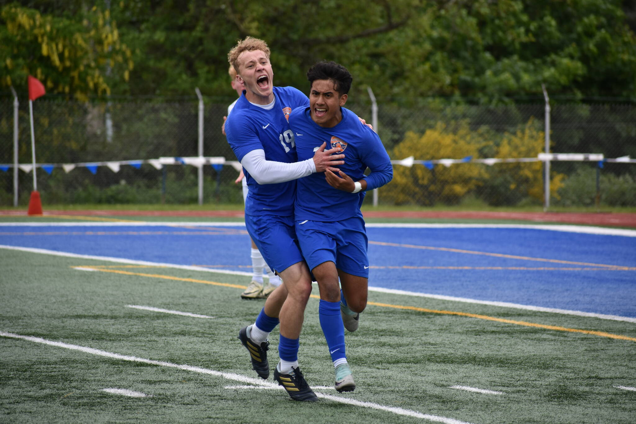 Davyd Fedina and Benji Toscano celebrate after taking the lead in the second half over Bainbridge. Ben Ray / The Reporter