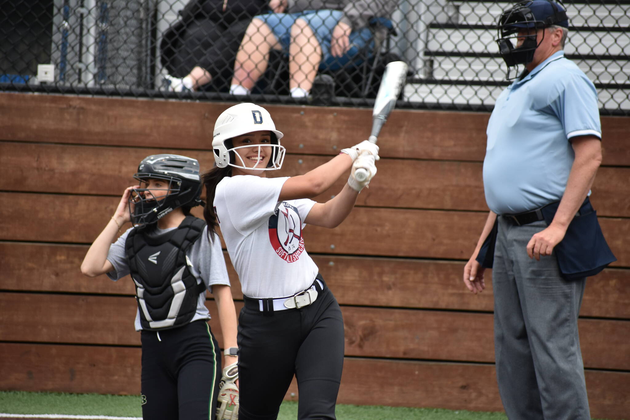 Decatur’s Luci Pech gives a smile during a practice swing. Ben Ray / The Mirror