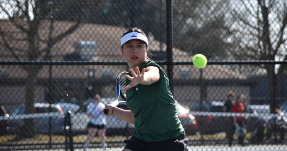Auburn tennis player eyes down the ball for a forehand. Ben Ray / The Reporter