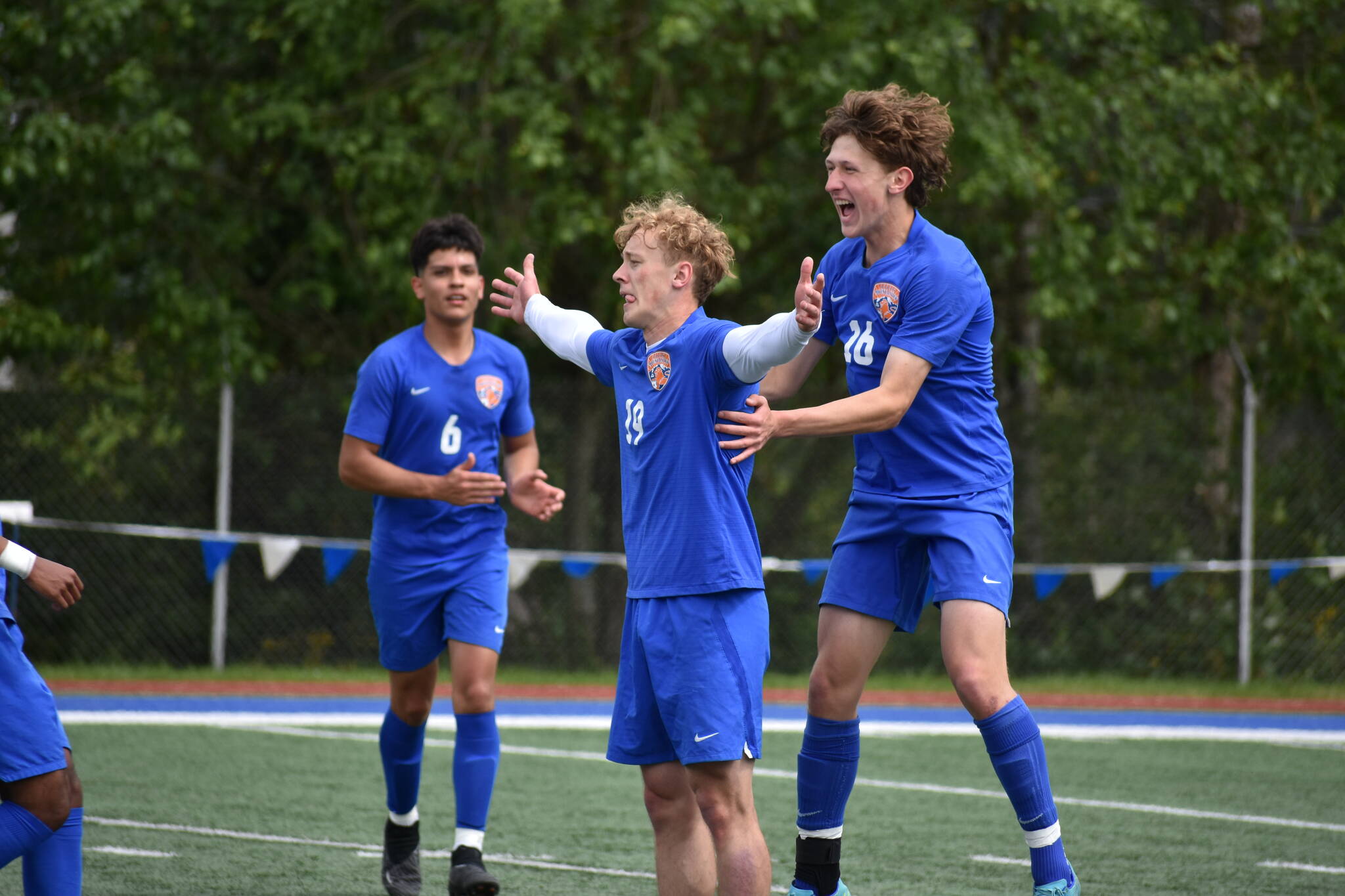 NPSL 3A Player of the Year Davyd Fedina gets swarmed in the state tournament. Ben Ray / The Reporter