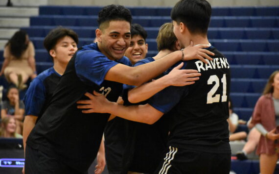 A pod of Ravens gives some smiles during senior night. Ben Ray / The Reporter