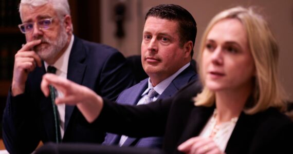 Auburn Police Officer Jeffrey Nelson, center, is flanked by two of his defense attorneys Tim Leary, left, and Emma Scanlan, right, during closing arguments at Maleng Regional Justice Center in Kent on Thursday, June 20, 2024. (Ken Lambert / The Seattle Times / Pool)