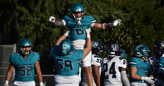 Auburn Riverside celebrates a touchdown. (Sound Publishing file photo)