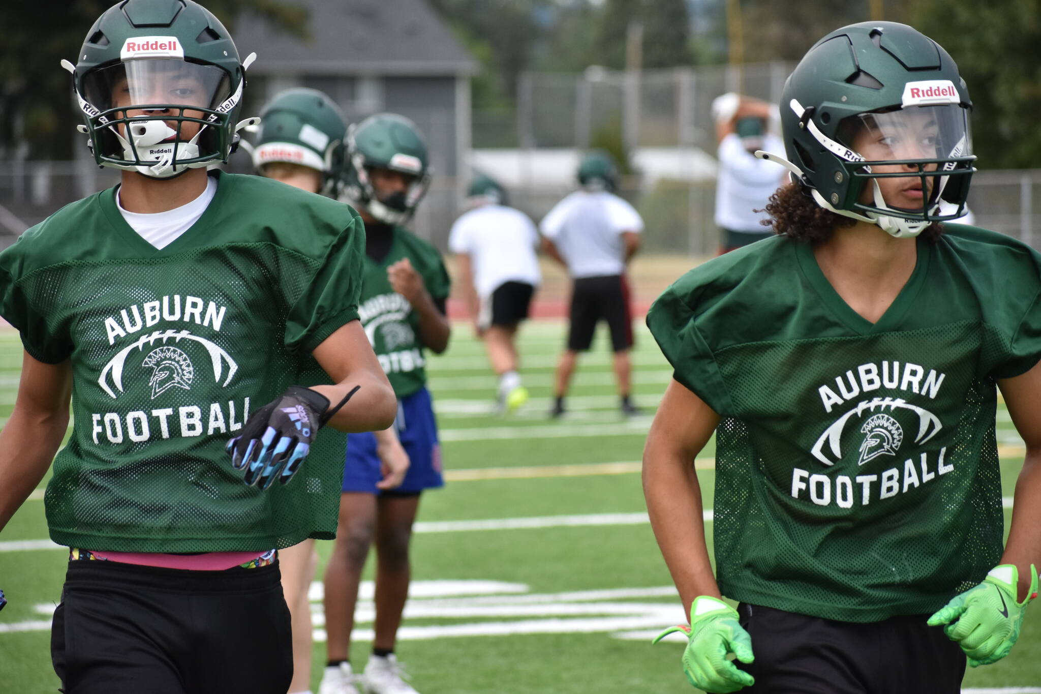 A couple of Auburn Trojans put in work during wide receiver drills. Photos by Ben Ray / The Reporter