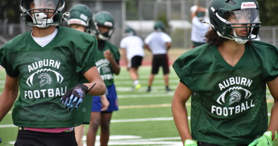 A couple of Auburn Trojans put in work during wide receiver drills. Ben Ray / The Reporter