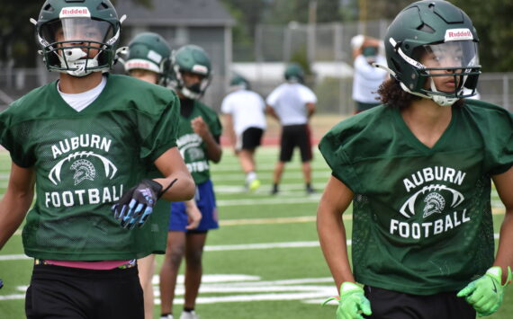 A couple of Auburn Trojans put in work during wide receiver drills. Ben Ray / The Reporter