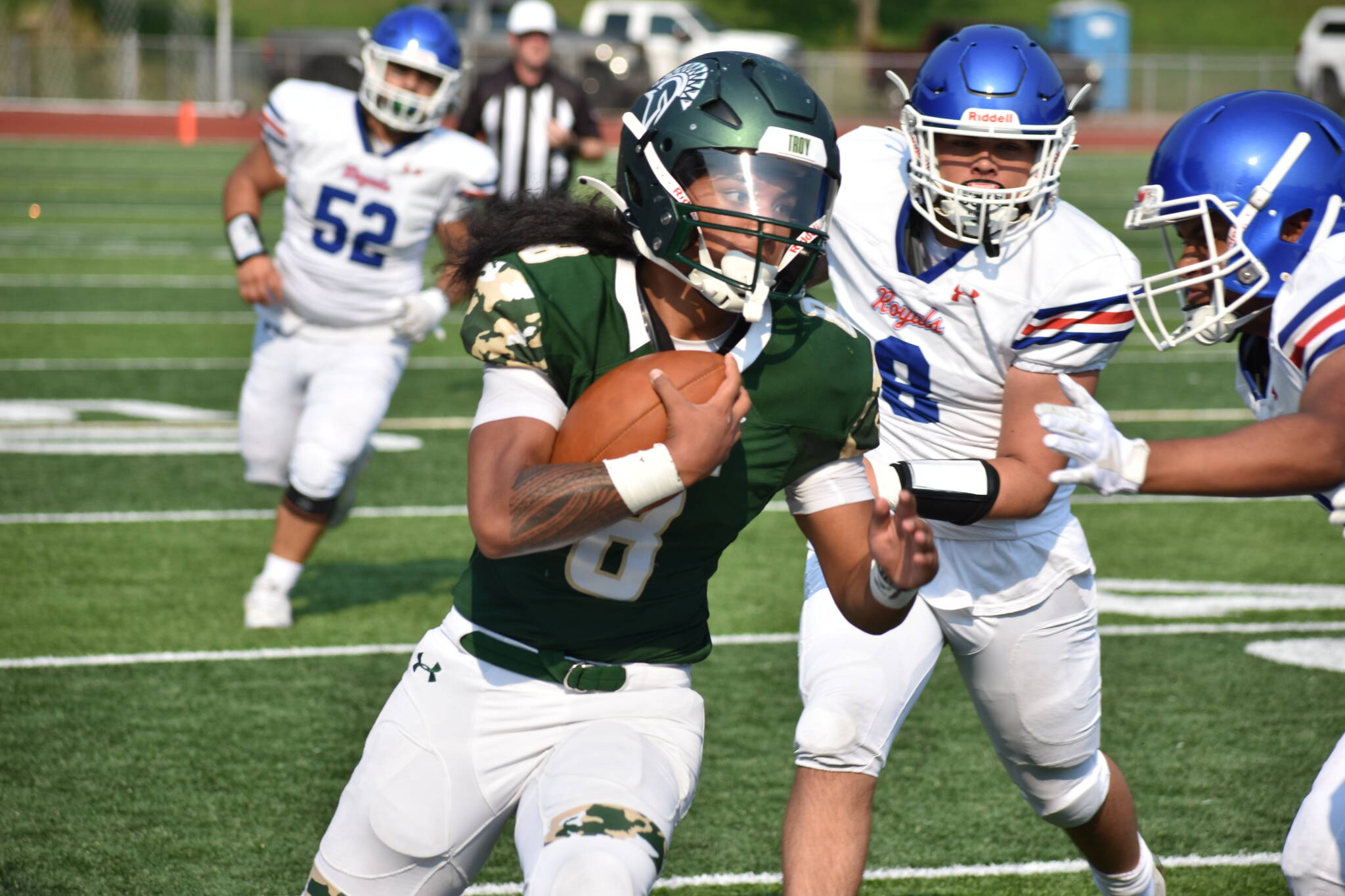 Auburn senior RJ Conlan shakes off a Kent-Meridian defender. Ben Ray / The Reporter