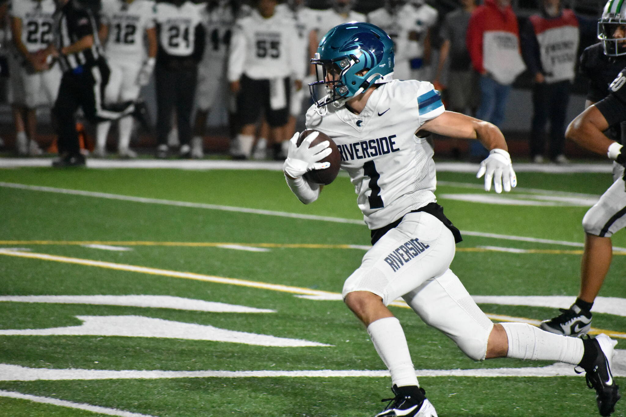 Raven junior Isaac Mospanko runs upfield for Auburn Riverside. Ben Ray / The Reporter