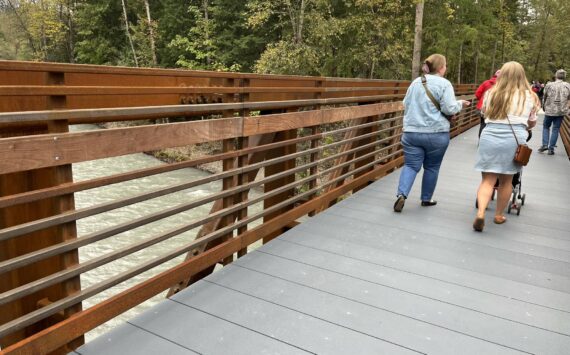 Pedestrians try out the new bridge Oct. 1 at Game Farm Park. Photos by Andy Hobbs/Auburn Reporter