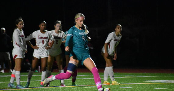 Caitlyn Riggs takes a penalty shot against Kennedy Catholic, a shot which gave the Ravens the lead. Ben Ray / The Reporter