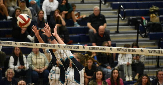 Peyton Cantrell and Bryanna Dodson go up for a block against Kennedy Catholic. Ben Ray / The Reporter