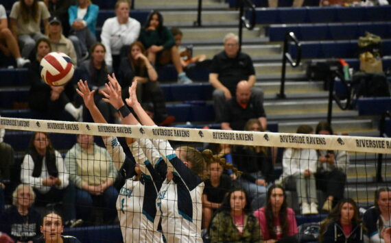 Peyton Cantrell and Bryanna Dodson go up for a block against Kennedy Catholic. Ben Ray / The Reporter