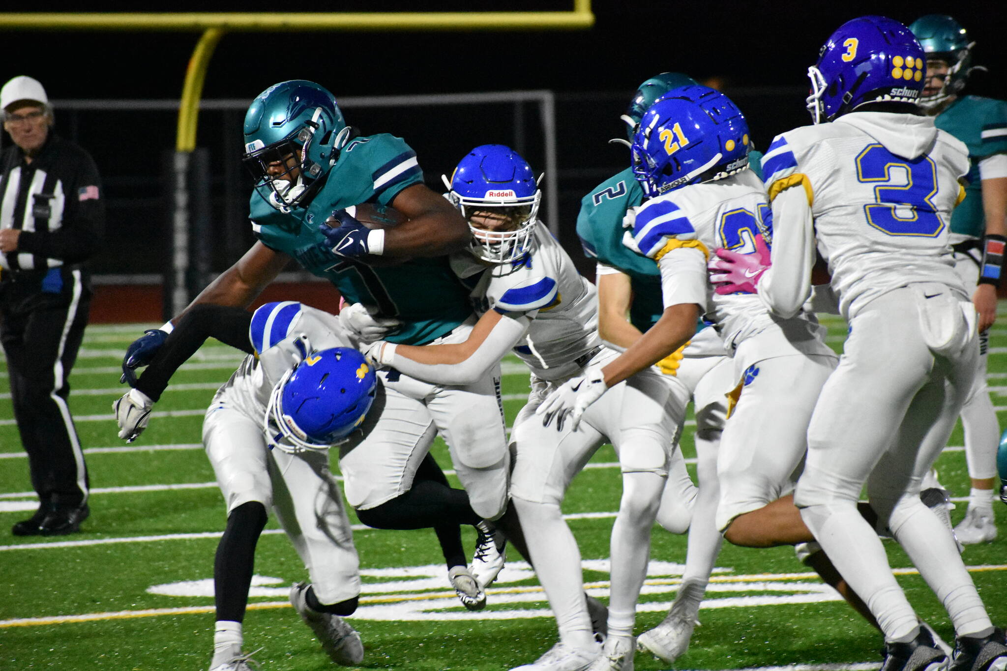 Jonathan Epperson takes on a slew of Tiger tacklers in the second half. Ben Ray / The Reporter