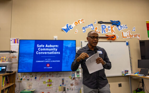 Master of ceremonies Waylon Menzia leads off the public safety meeting at Chinook Elementary. Photo courtesy of City of Auburn