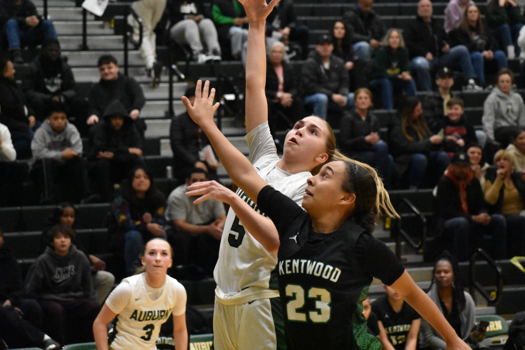 Trojan sophomore Morgan Richardson gets in a lay-up against Kentwood. Ben Ray / The Reporter