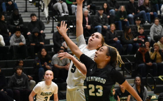 Trojan sophomore Morgan Richardson gets in a lay-up against Kentwood. Ben Ray / The Reporter