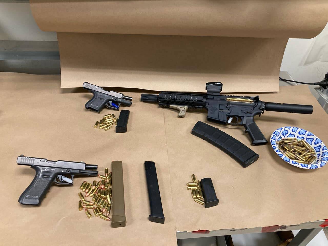 Three firearms and magazines retrieved from the suspect’s home and vehicle. (Photo courtesy of Auburn Police Department)