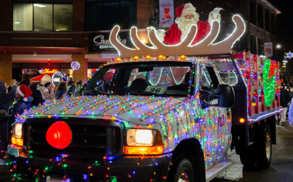 A truck tricked out with the bright, cheerful lights of the Christmas season.