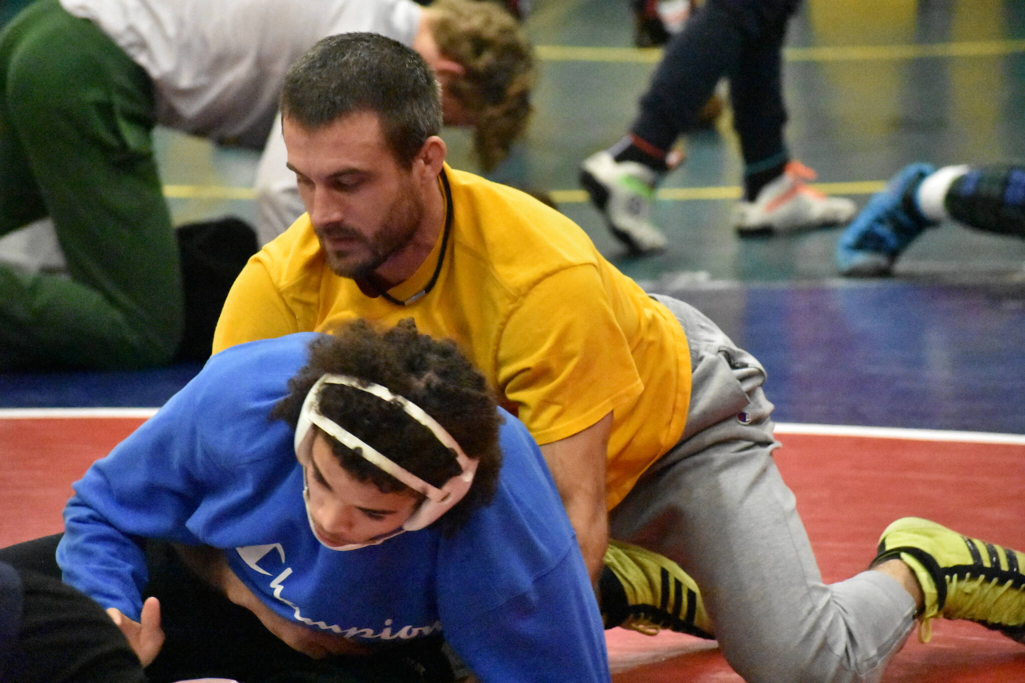 Auburn Head Coach Shane Ornufer works with Lucas Whitehall-Gilkes during practice. Ben Ray / The Reporter