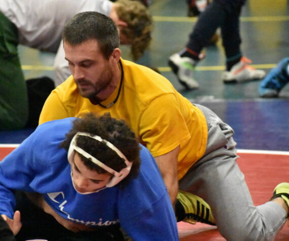 Auburn Head Coach Shane Ornufer works with Lucas Whitehall-Gilkes during practice. Ben Ray / The Reporter