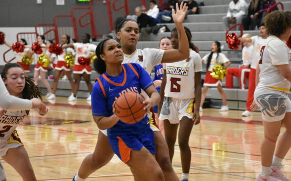 Kyra Thomas makes a layup against Thomas Jefferson. Photos by Ben Ray / The Reporter