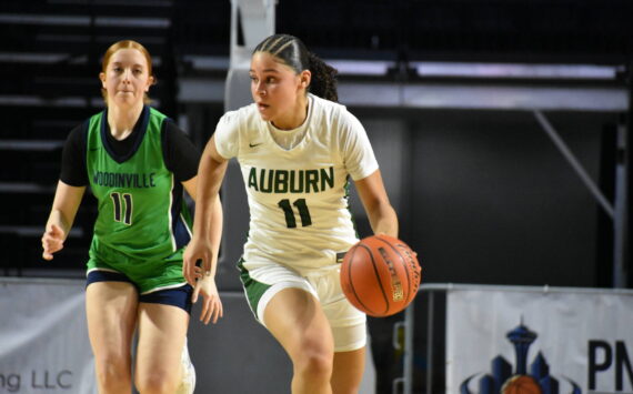 Auburn’s Kaleesa Howard dribbles the ball up the floor for the Trojans. Ben Ray / The Reporter